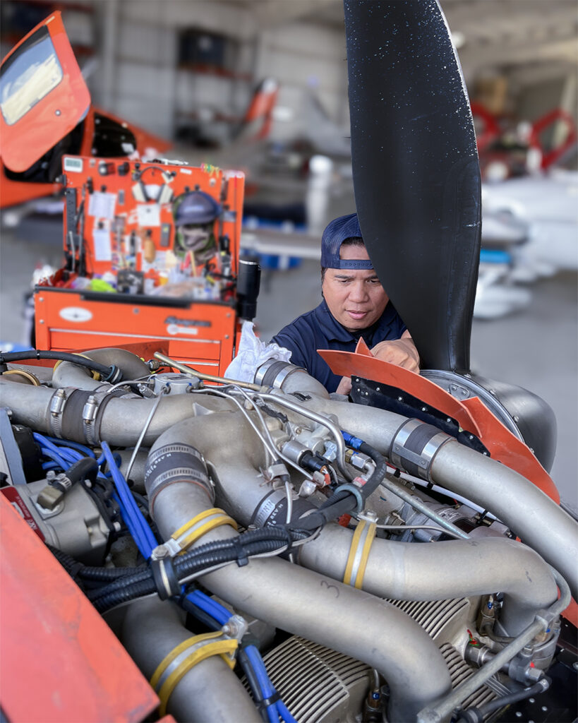 Aircraft technician Joe works on alternator of Cirrus SR22T at Fixed Wing Aviation Maintenance in Lakeland, FL